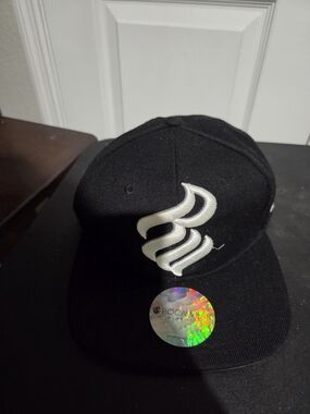 Rocawear Black Snapback with White Embroidered Swirl Logo
